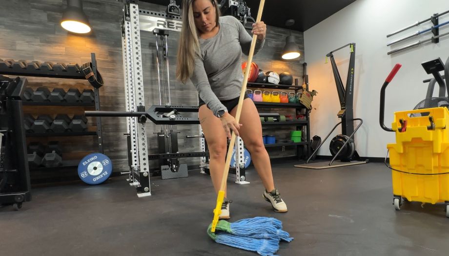 woman mopping rubber flooring