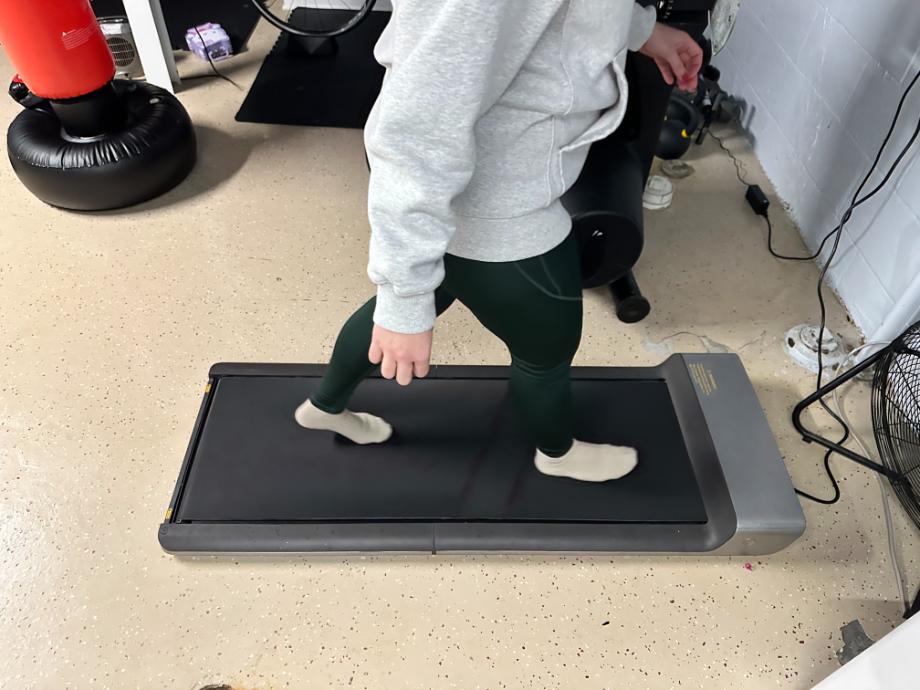 A woman walking on a WalkingPad Treadmill