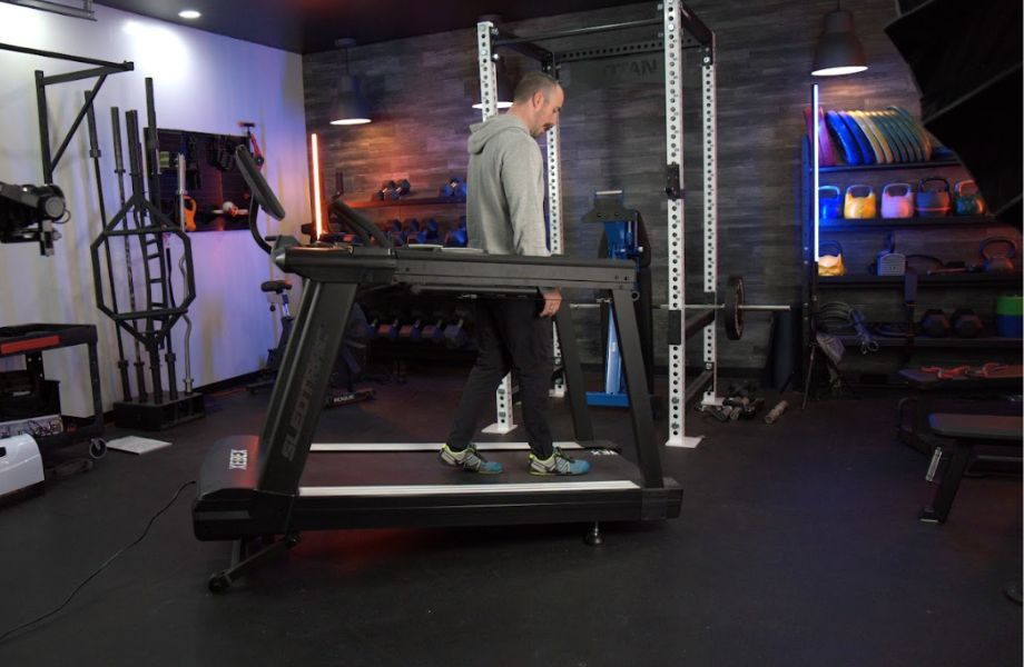 Man walking backwards at a decline on the Xebex ST-6000 treadmill