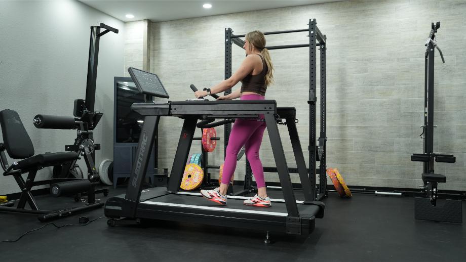 Woman using sled pull function on Xebex ST-6000 treadmill