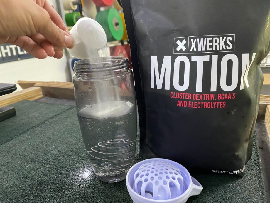Pouring XWERKS Motion into a cup